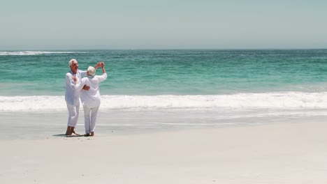 old retired couple dancing together