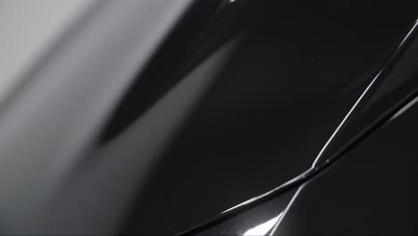 close-up view of a polished black car body