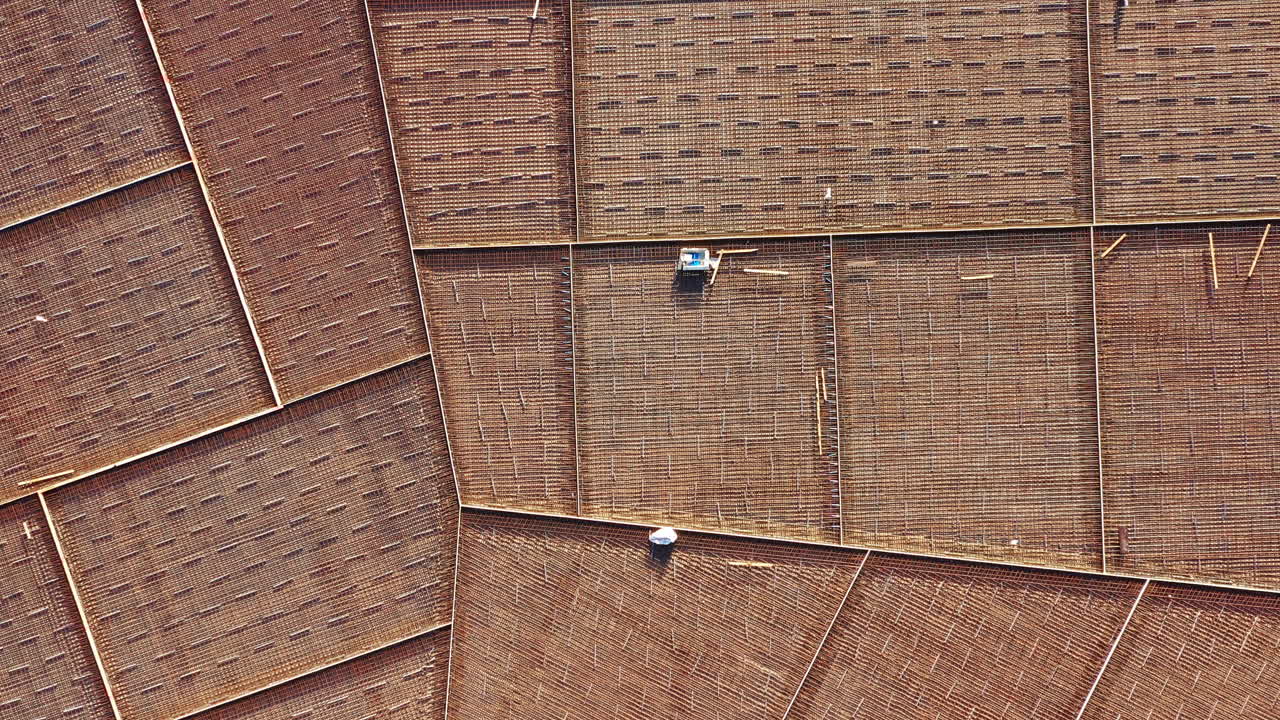 Top-down view of foundation rebar grid prepared for industrial park construction site