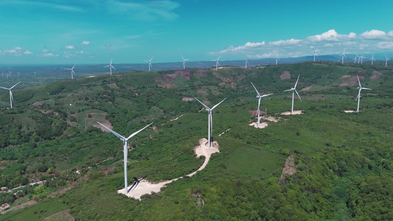 Onshore Wind Turbines In The Mountains Generating Electricity From Wind In Barahona, Dominican Republic. - aerial shot