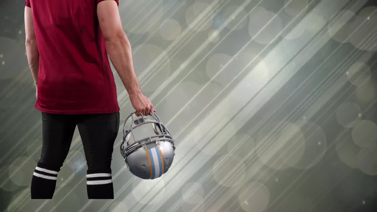 animación de un jugador de fútbol americano caucásico sobre rastros de luz y puntos en un fondo gris