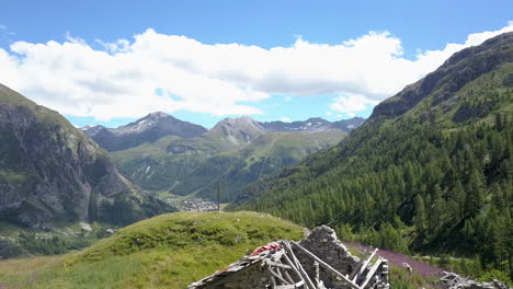Majestic Alpine Mountains with a Ruined Stone House