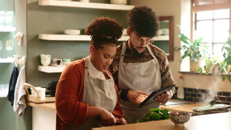 couple cooking together in the kitchen