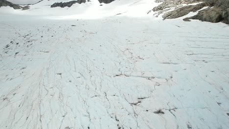 drone flyover majestic mount brewster glacier, famous hiking location in new zealand