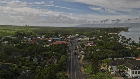 paia maui hawaii aerial v5 flyover town center along hana highway capturing views of scenic coastal drive and west maui mountains landscape on the skyline - shot with mavic 3 cine - december 2022