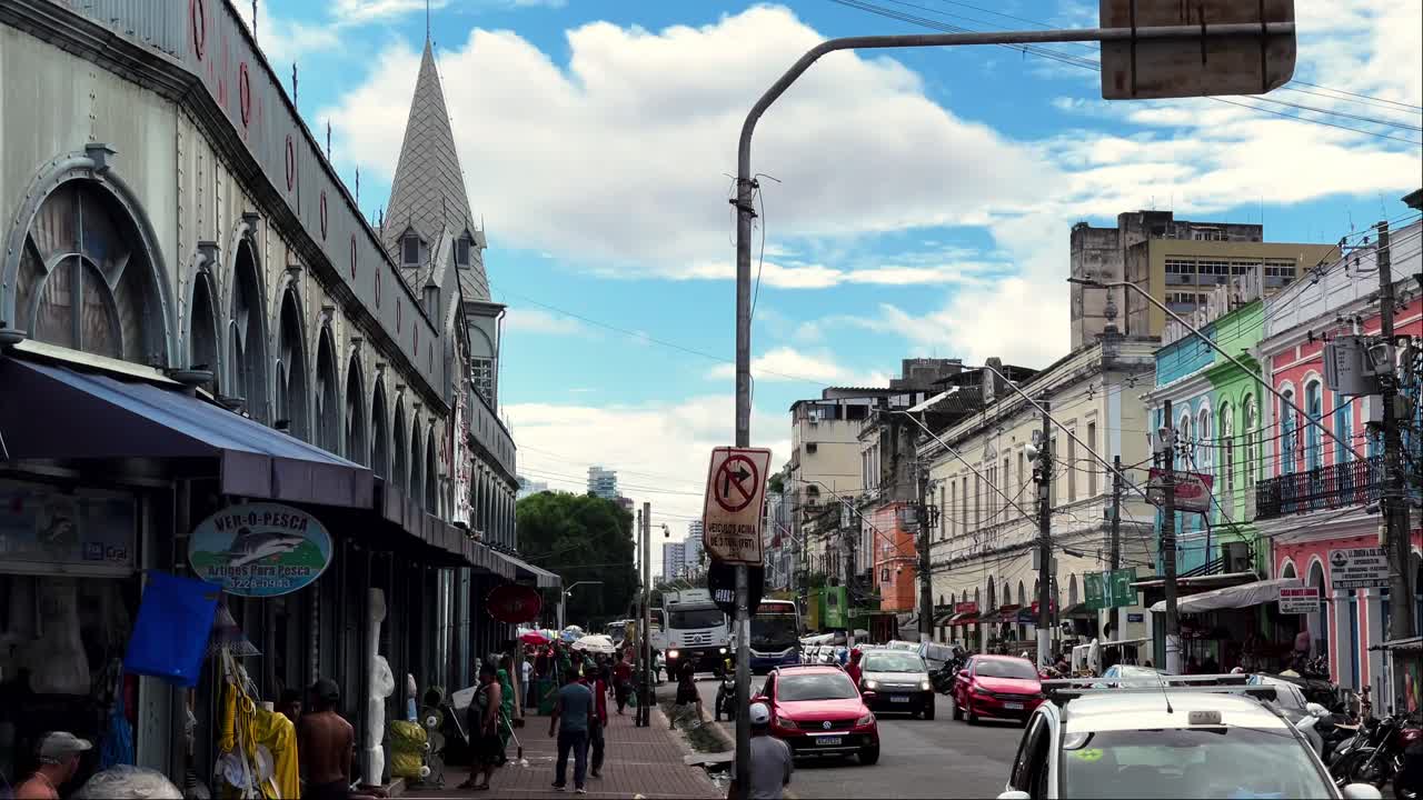 Brazil, Belem, The Ver-o-Peso Market and Surroundings:Panorama of the Ver-o-Peso market street, capturing the lively atmosphere, color stalls, and bustling activity. A vibrant snapshot of daily life