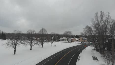 camera-going-forward-on-a-freeway-in-Minnesota,-winter,-snow,-cloudy