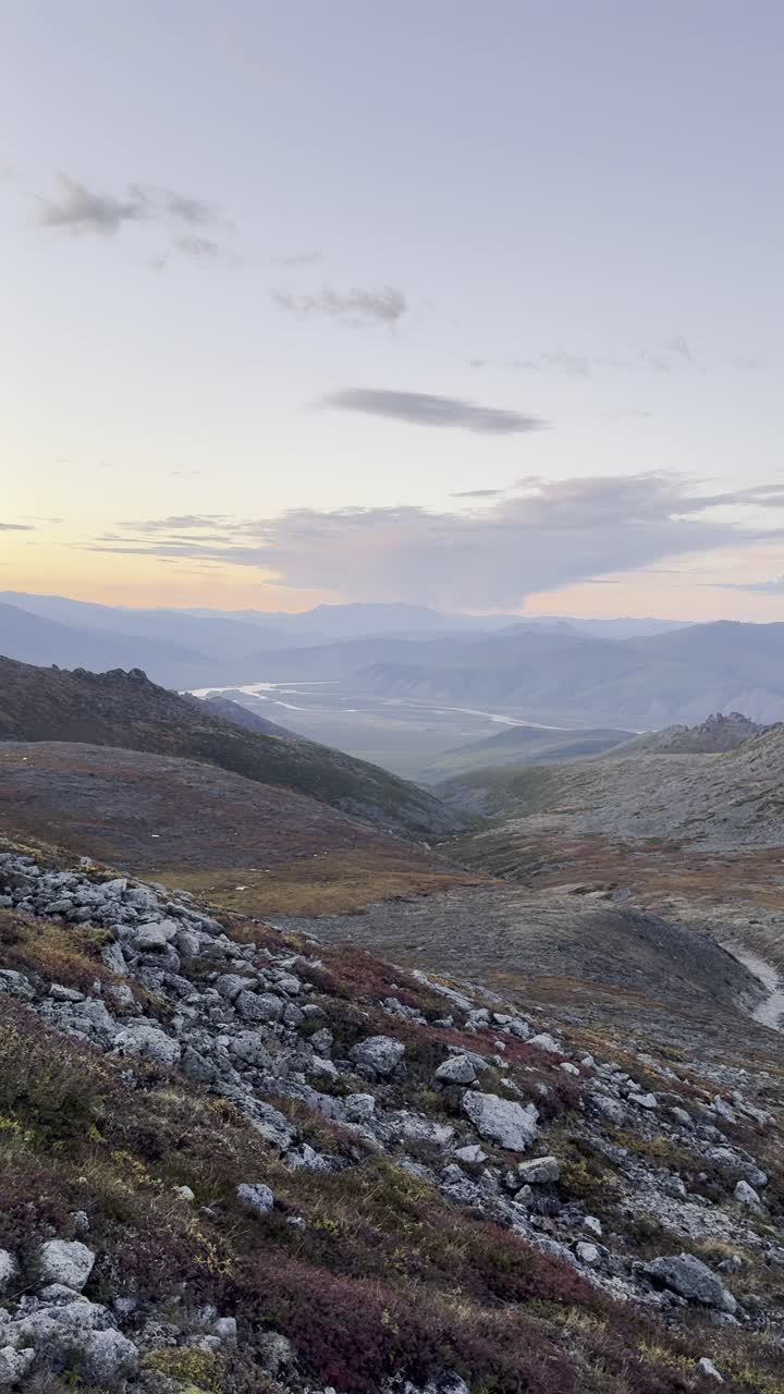 Golden hour illuminates a majestic mountain panorama