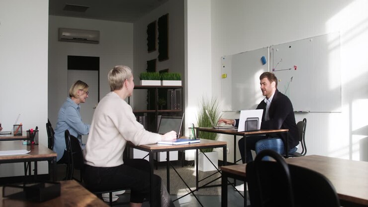 Male teacher explaining in classroom