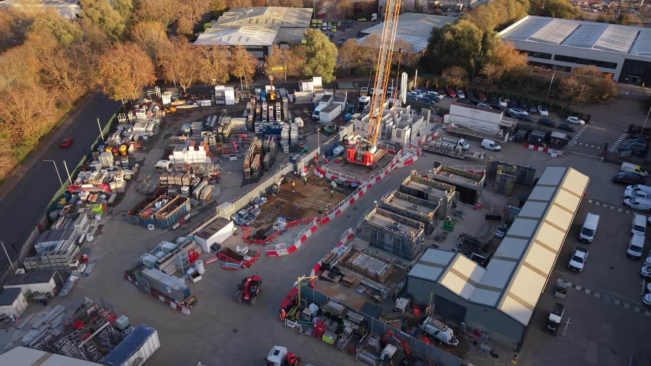 Crane Working at Daytime Construction Site in Industrial Park