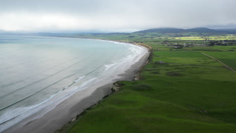 Monkey-island-beach-and-endless-landscape-of-New-Zealand,-aerial-orbit-view