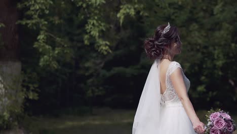 slow motion closeup young woman in wedding dress dances