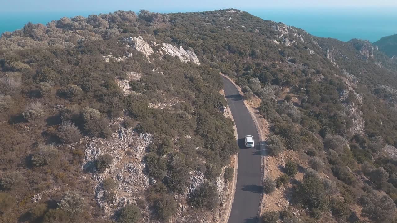 Car driving through the landscape of Samos, Greece.