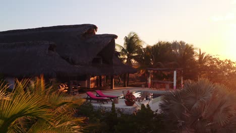 slow drone movement sunrise over luxury rental villa in oaxaca mexico