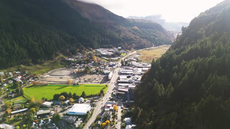 Scenic-drive-in-valley-from-Queenstown-to-Arthur's-Point,-nestled-between-mountains,-bathed-in-soft-light