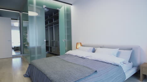 modern bedroom interior with glass wardrobe
