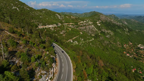 aerial view following traffic in the highlands of budva, summer day in montenegro