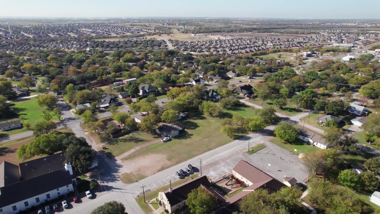 Aerial video of houses in the town of Rhome, Texas