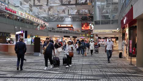 passengers and vehicles moving through busy terminal