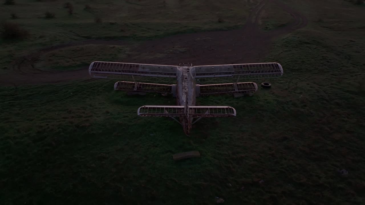 Drone view of old airplane resting in sunrise-lit field, Kalimantsi, Bulgaria