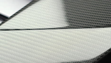 detail of a carbon fiber rear wing of a supercar. - close up