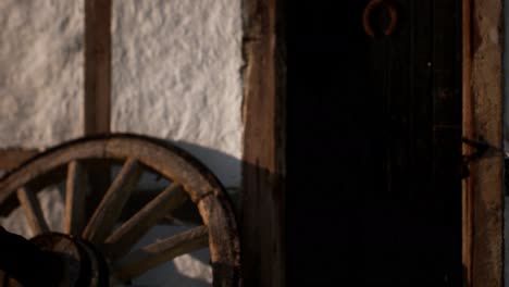 old-wood-wheel-and-black-door-at-white-house