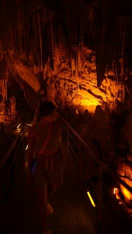 exploring a cave with orange light