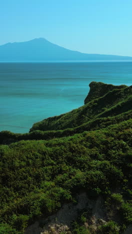 coastal landscape with turquoise water and mountains