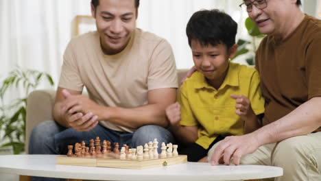 asian men and boy in the living room