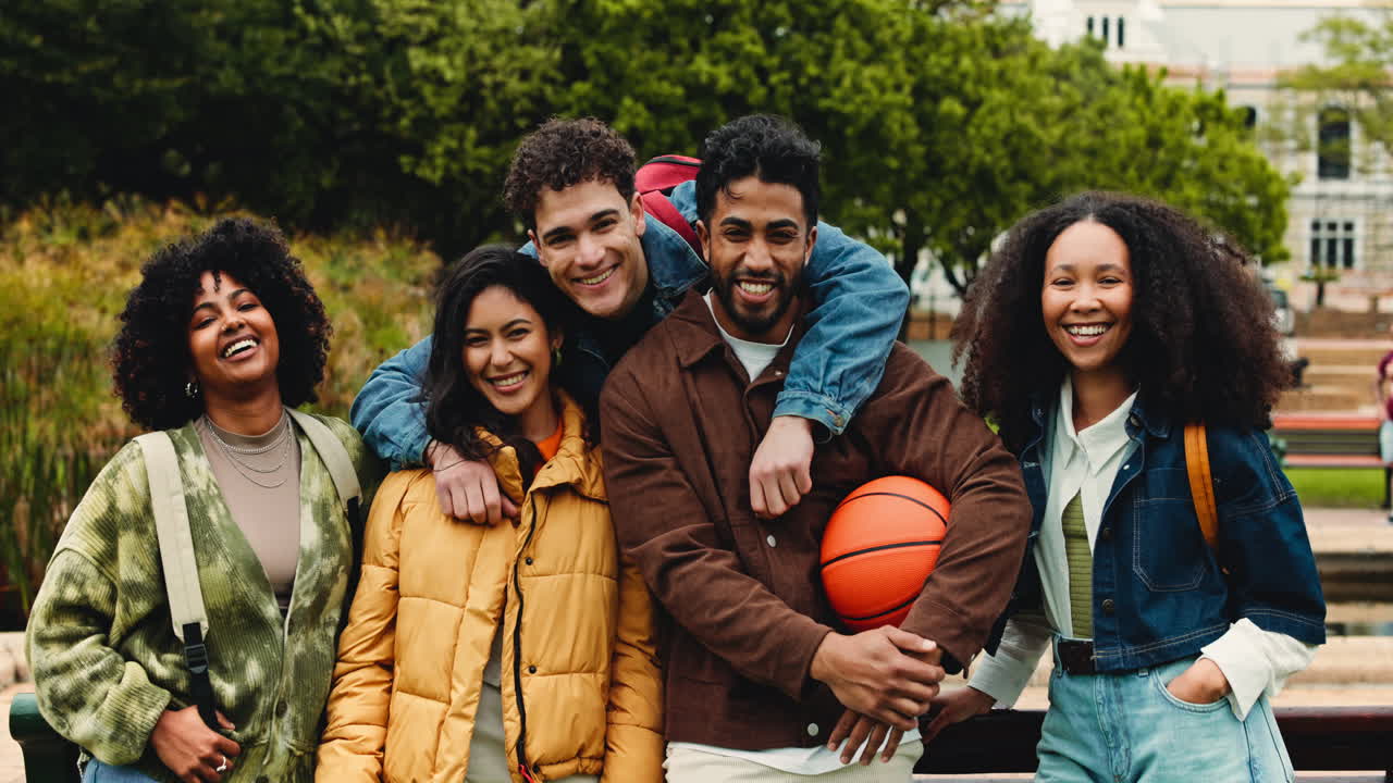 Diverse Group of Happy Young Friends Posing Outdoors with a Basketball