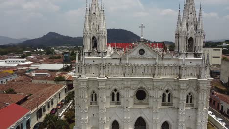 Aerial-orbits-ornate-front-facade-of-gothic-Santa-Ana-Cathedral,-SLV