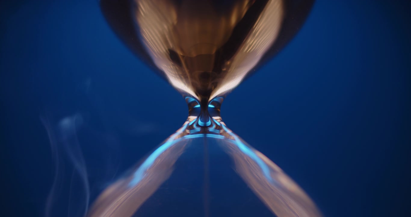 Smoke slowly wraps blue hourglass