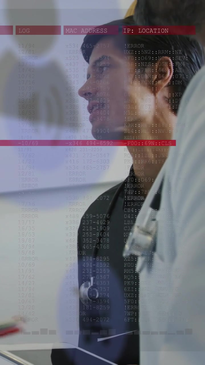 Vertical video: Male doctor responding after tablet tap, showing medical data overlay for review