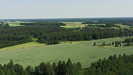 Flight-over-farm-fields-and-forests