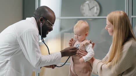 African-American-Pediatrician-Checking-Baby-Heartbeat-with-Stethoscope