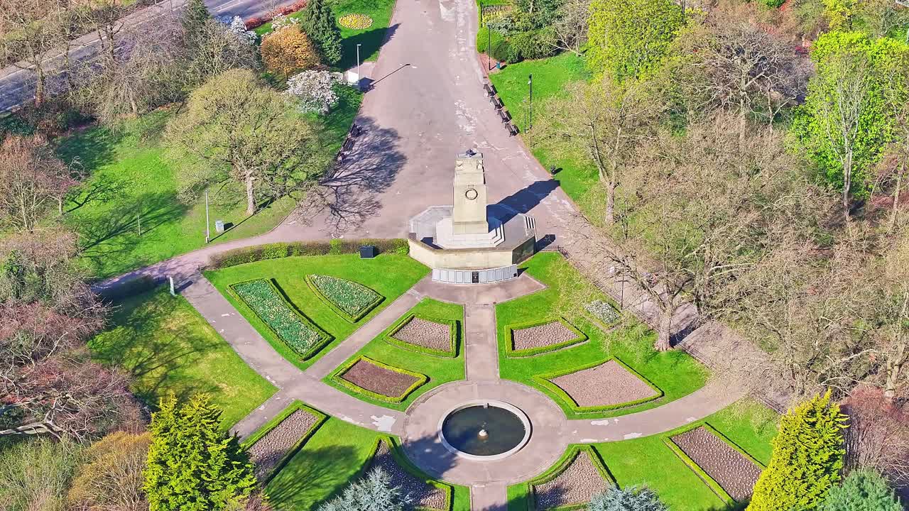 Straight down aerial of intersecting park trails, trees, and manicured grass spaces Rotherham Clifton Park War Memorial