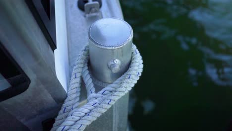 Boat-tied-with-mooring-rope-knot-on-bollard