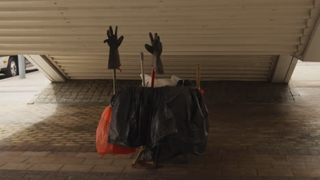 maintenance cart with cleaning supplies underpass