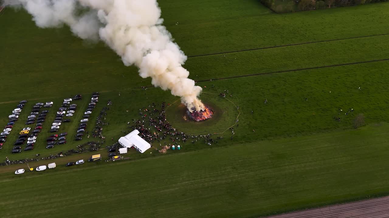Large Bonfire Celebration in a Field