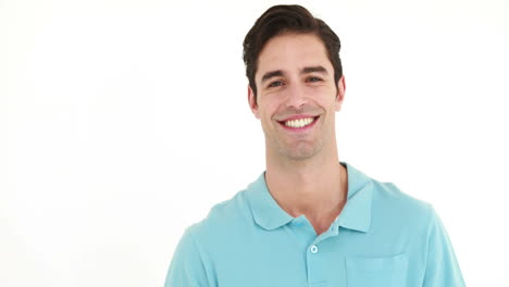 Smiling-man-playing-with-badminton-racket-and-showing-thumb-up