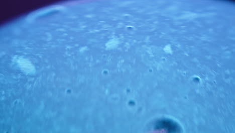 abstract blue liquid with bubbles macro photography
