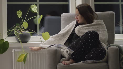 woman struggles with indoor winter temperatures