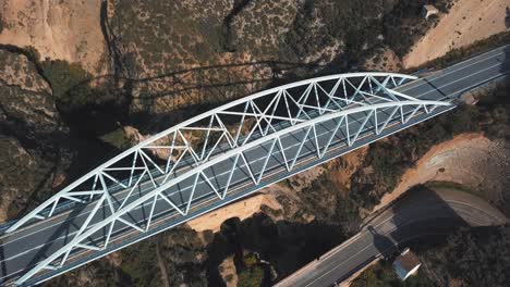 Aerial-view-of-a-modern-bridge-on-top-of-another-two-older-bridges-from-different-periods