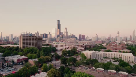 cinemeatic-aerial-of-chicago-downtown,-revealing-american-footbal-field