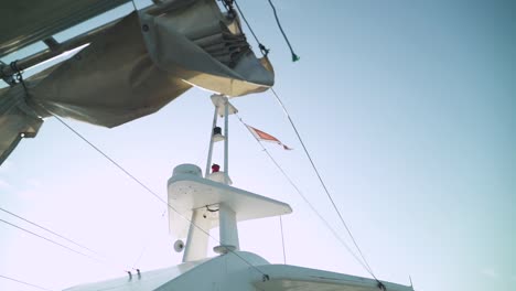 Malta's-flag-waving-in-the-wind---hanging-on-a-boat-sailing-at-sea