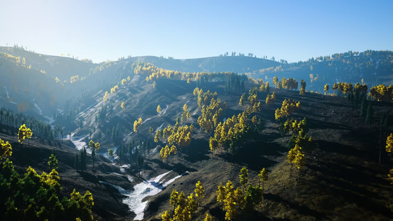 Stunning valley view with vibrant autumn colors and flowing creek at dawn