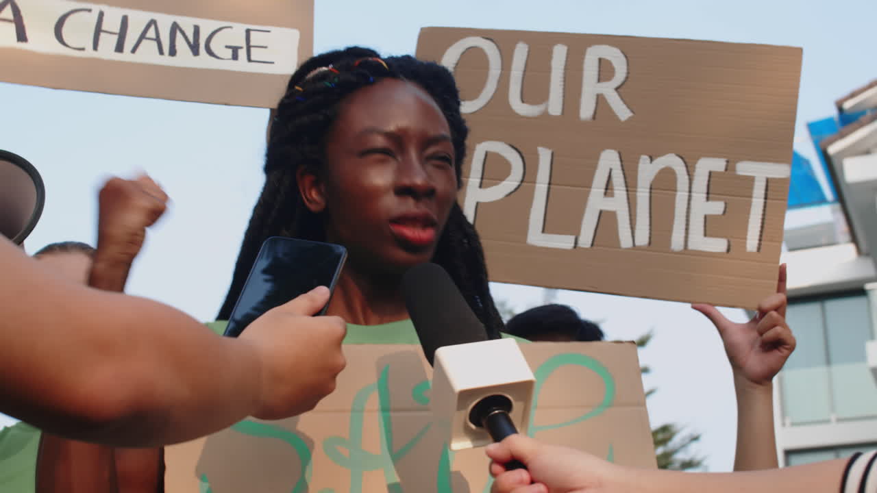 African American Eco Activist Talking to Journalists