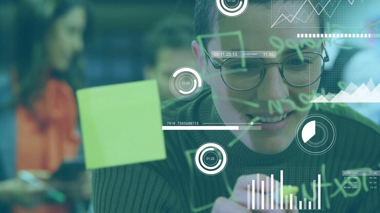 Woman leaning forward, drawing on glass board, animating HUD charts over markings for education