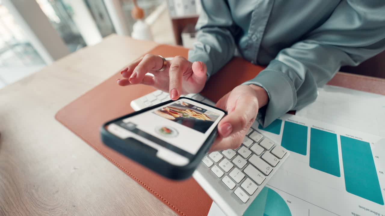 Person using a smartphone while working in an office
