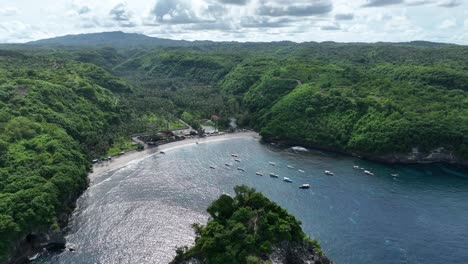 beach with boats during daytime - crystal beach nusa penida indonesia
